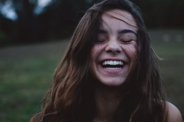 young woman smiling happily